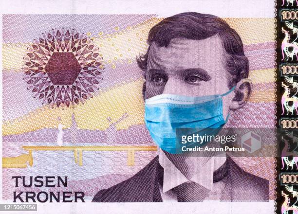 norway quarantine, 1000 nok banknote with medical mask. the concept of epidemic and protection against coronavrius. - norway money stockfoto's en -beelden