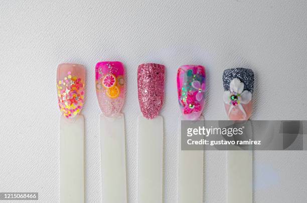 fake painted nails manicure - nail art stock pictures, royalty-free photos & images