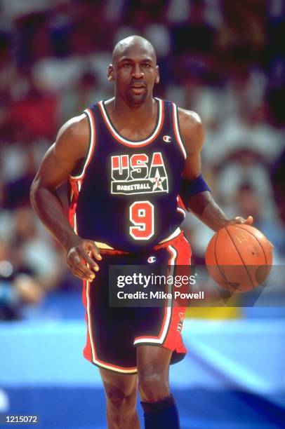 MICHAEL JORDAN OF THE UNITED STATES DRIBBLES THE BALL DOWN THE COURT DURING A BASKETBALL MATCH AGAINST GERMANY AT THE 1992 BARCELONA OLYMPICS IN...