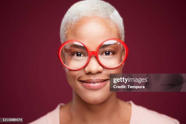 young woman wearing huge nerdy glasses. - columbian mammoth stock pictures, royalty-free photos & images