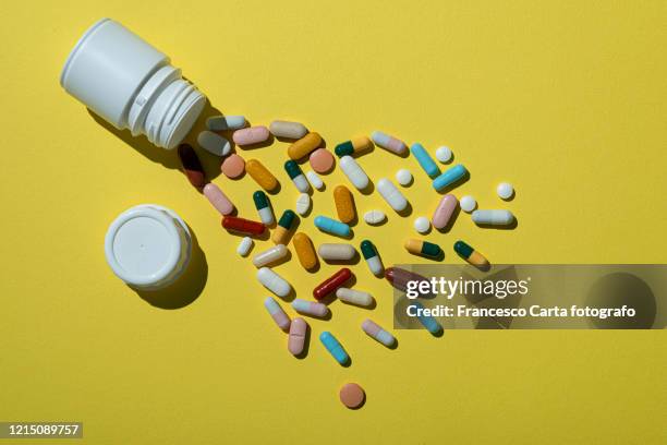 assorted pills - medicine bottle stock pictures, royalty-free photos & images