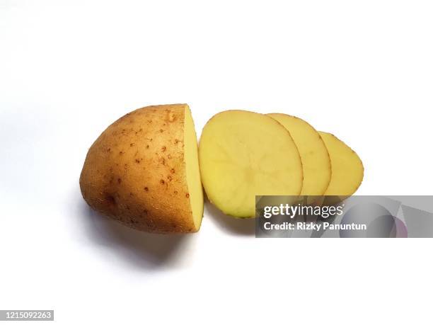 freshly cut potato isolated on white background - halved potato stock pictures, royalty-free photos & images