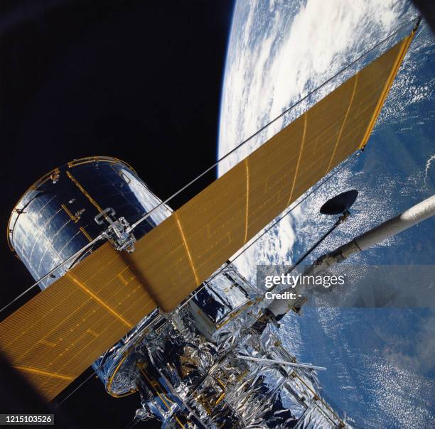Picture taken on April 25, 1990 by the STS-31 crew aboard the Space Shuttle Discovery, shortly before the Hubble Space Telescope was deployed,...