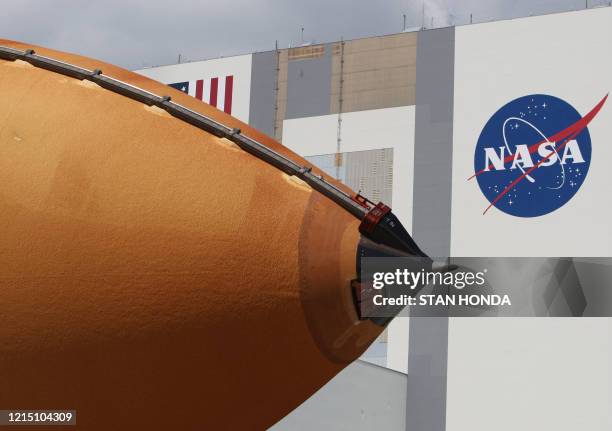 The nose of a space shuttle external fuel tank is moved to the Vehicle Assembly Building on March 26 at Kennedy Space Center in Florida. The tank is...