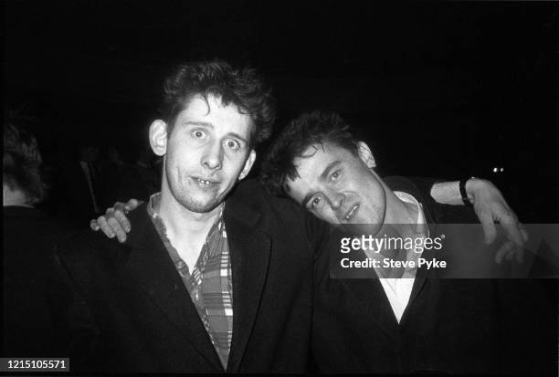 British singer-songwriter Shane MacGowan and British tin whistle player and singer Spider Stacy, with their arms around each other, in Kilburn,...