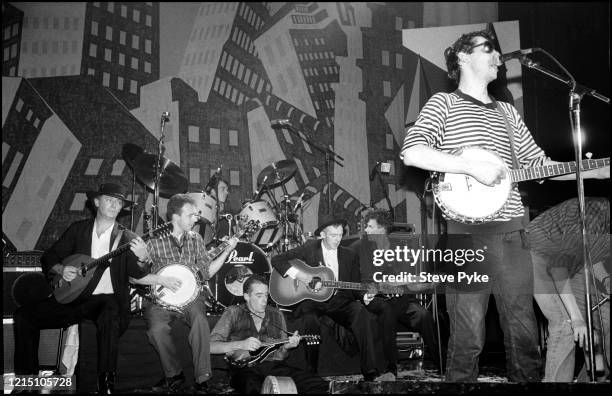 Irish folk musician Terry Woods, British banjo player and songwriter Jem Finer, British musician James Fearnley, British drummer Andrew Ranken, Irish...