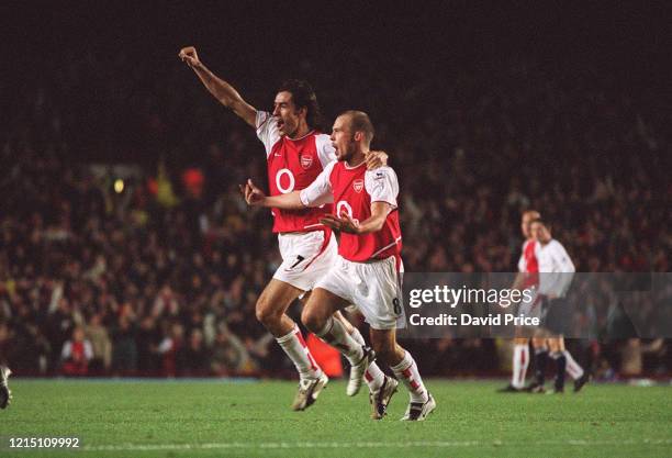 Freddie Ljungberg celebrates scoring a goal for Arsenal with Robert Pires during the Premier League match between Arsenal and Tottenham Hotspur on...