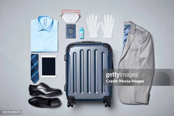 businesswear with luggage and travel safety travel accessories against covid-19 - suitcase from above imagens e fotografias de stock