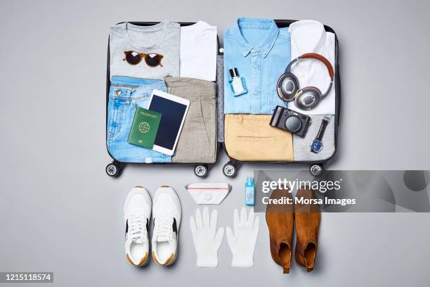 flat lay of traveler's clothing and accessories - pasaporte mexicano fotografías e imágenes de stock