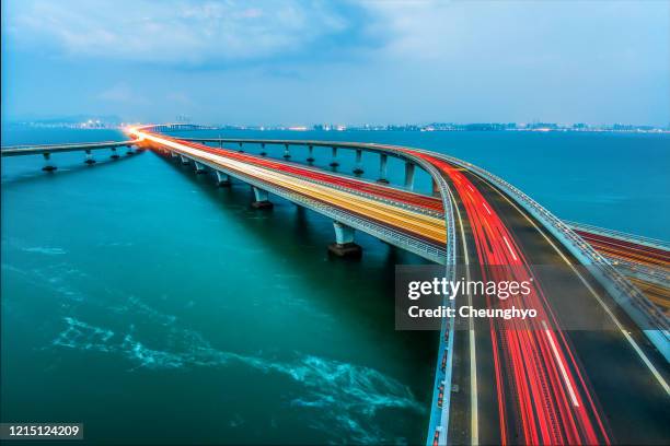 jiaozhou bay bridge of qingdao,shandong province,china - china modern city stockfoto's en -beelden