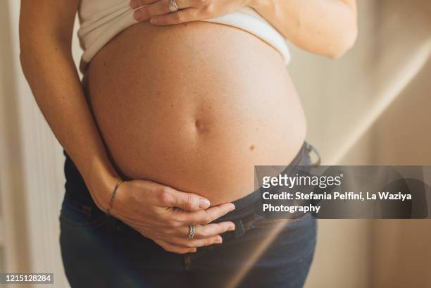 nude pregnant belly - abdomen stock pictures, royalty-free photos & images
