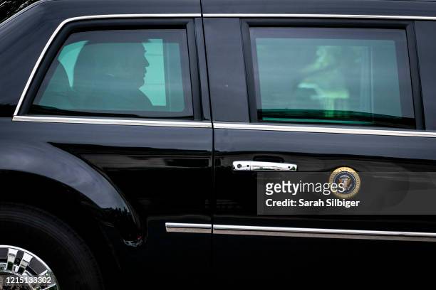 President Donald Trump and first lady Melania Trump ride in a motorcade as they depart from the White House on May 25, 2020 in Washington, DC. The...