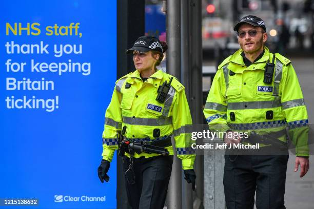 Two police officers patrol on Argyll Street on March 27, 2020 in Glasgow, Scotland.Scotland. First Minister of Scotland Nicola Sturgeon along with...