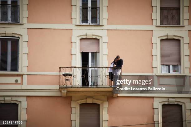 People spend a lot of time on balconies or looking out of windows due to quarantine restrictions during the COVID-19 pandemic on March 27, 2020 in...