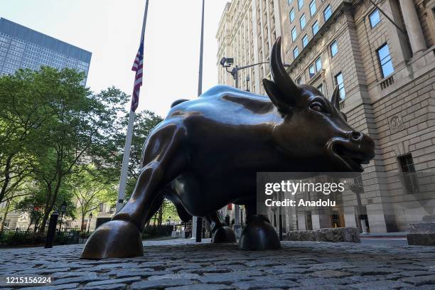 The Wall Street Bull is seen during Covid-19 pandemic in Lower Manhattan, New York City, United States on May 26, 2020. Wall Street trading floor...