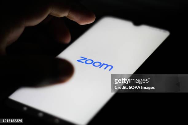 In this photo illustration a Zoom Video logo seen displayed on a smartphone.