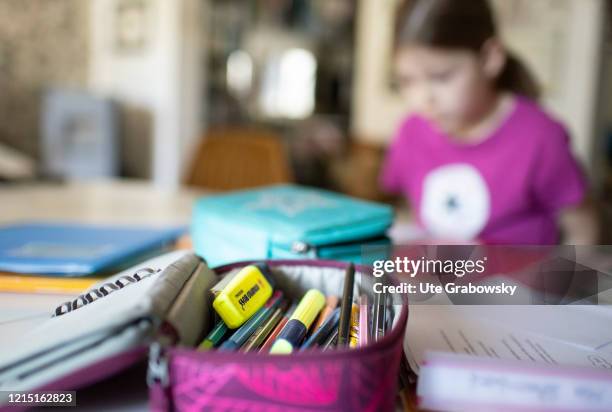 In this photo illustration a girl is doing homeschooling in times of corona Pandemic on May 19, 2020 in Bonn, Germany.