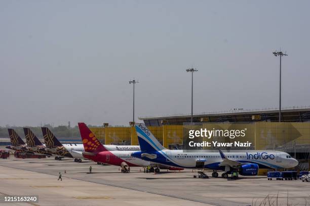 Aircraft stand at Terminal 3 at the Indira Gandhi International Airport, as the country relaxed its lockdown restriction on May 26, 2020 in Delhi,...