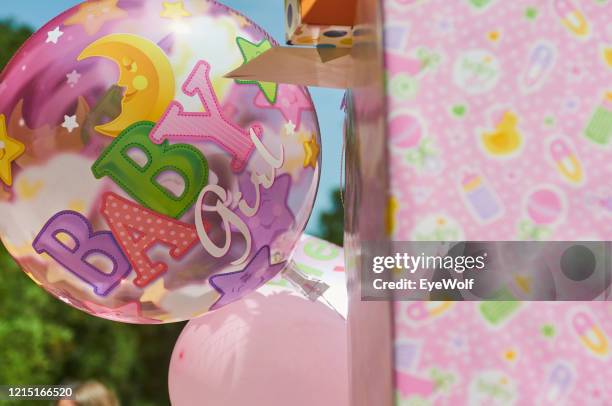 a balloon outside at a baby shower that says “baby girl” - outdoor baby shower stock pictures, royalty-free photos & images