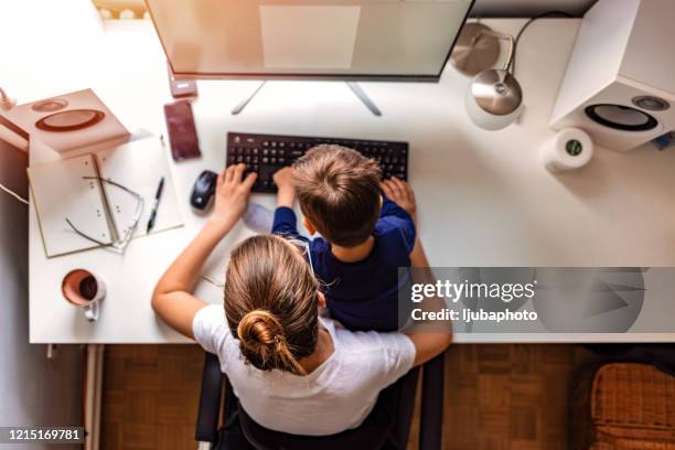 young mother working from home - woman home with sick children imagens e fotografias de stock