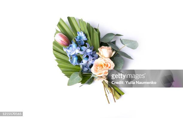 bouquet of tropical leaves with roses, tulip and hyacinth, branch palm with colorful flowers on a white background. - blumenstrauß freisteller stock-fotos und bilder
