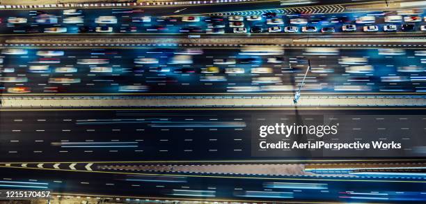 aerial top down view of city traffic on a highway at night - traffic jam aerial stock pictures, royalty-free photos & images