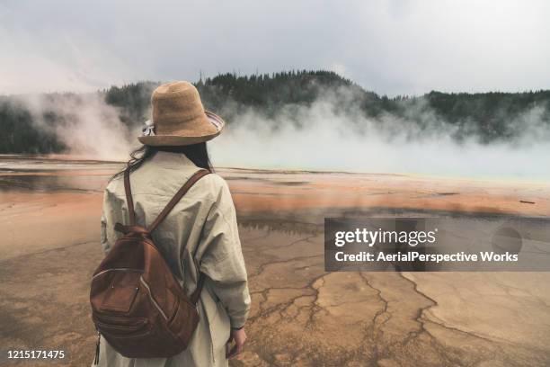 rear view of woman at yellowstone - yellowstone river stock pictures, royalty-free photos & images