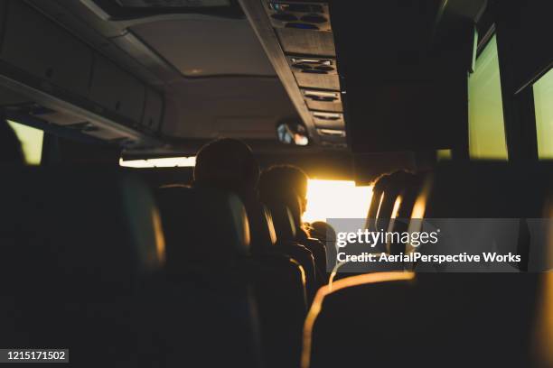 viaje en autobús a la luz del sol - bus interior fotografías e imágenes de stock