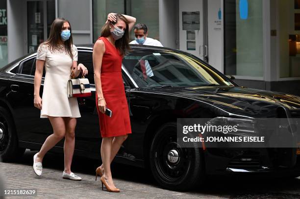 Governor of New York Andrew Cuomo arrives with with his daughter Mariah Kennedy-Cuomo and Melissa DeRosa, secretary of the Governor to ring the...