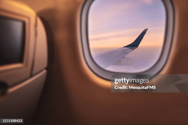 sunrise - airplane window - aircraft wing stock pictures, royalty-free photos & images