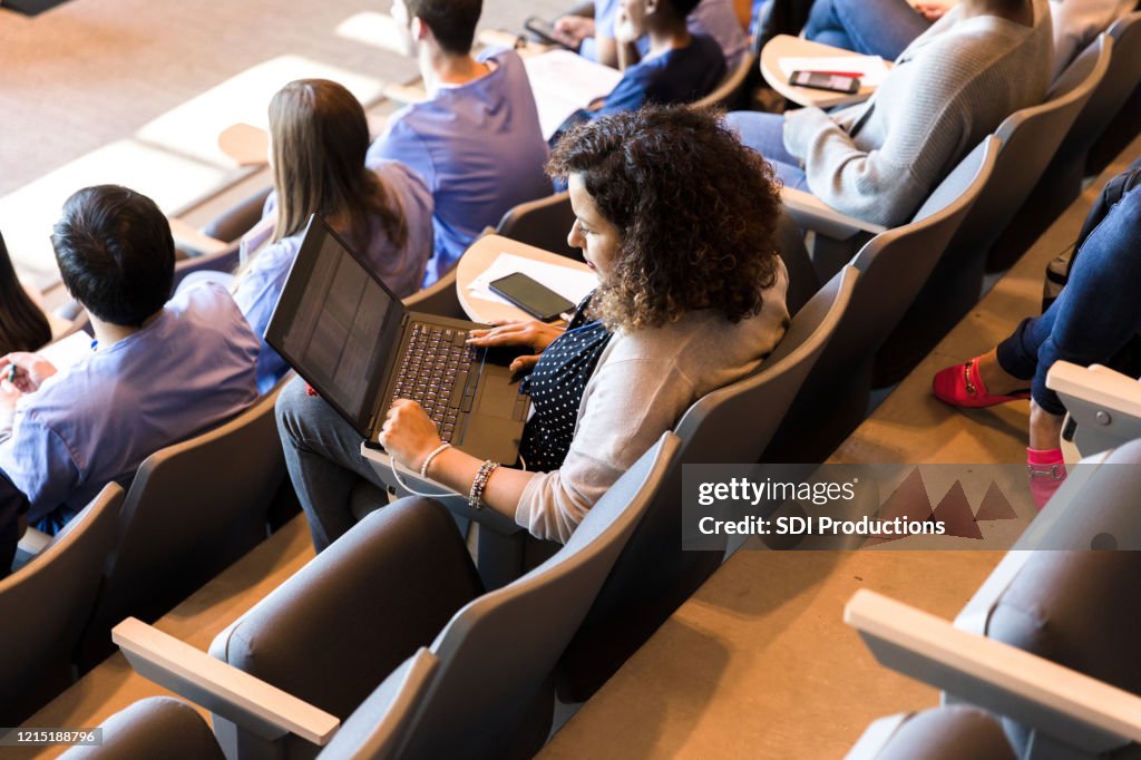 High angle view diverse students in college class