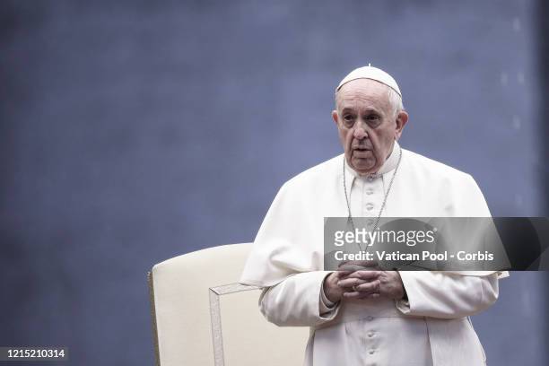 Pope Francis prays on the sagrato of St. Peter's Square to deliver a special Urbi et Orbi Blessing to the world, on March 27, 2020 in Vatican City,...