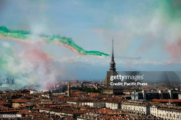 The Italian national aerobatic team, the Frecce Tricolore, flies near of the Mole Antonelliana of Turin.