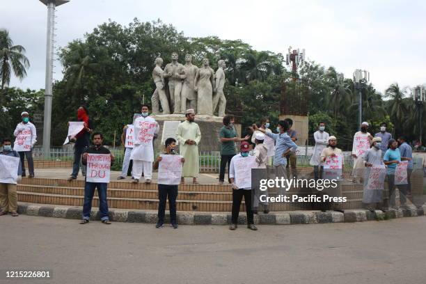Bangladesh Student's Union members protest against the metro rail station standing near the Anti Terrorism Raju Memorial Sculpture at TSC at Dhaka...