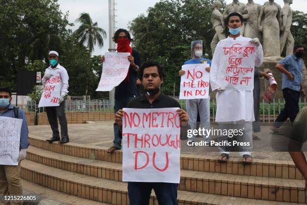 Bangladesh Student's Union members protest against the metro rail station standing near the Anti Terrorism Raju Memorial Sculpture at TSC at Dhaka...