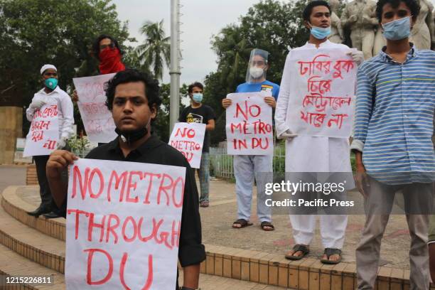 Bangladesh Student's Union members protest against the metro rail station standing near the Anti Terrorism Raju Memorial Sculpture at TSC at Dhaka...