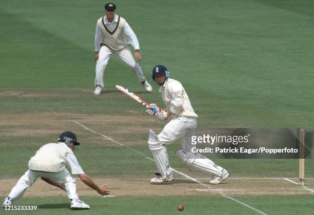 England batsman Mike Atherton plays the ball past Greg Blewett of Australia during his innings of 77 in the 2nd Test match between England and...
