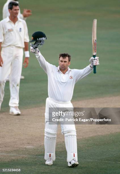 Australia's captain Mark Taylor celebrates reaching his century during his innings of 129 in the 1st Test match between England and Australia at...