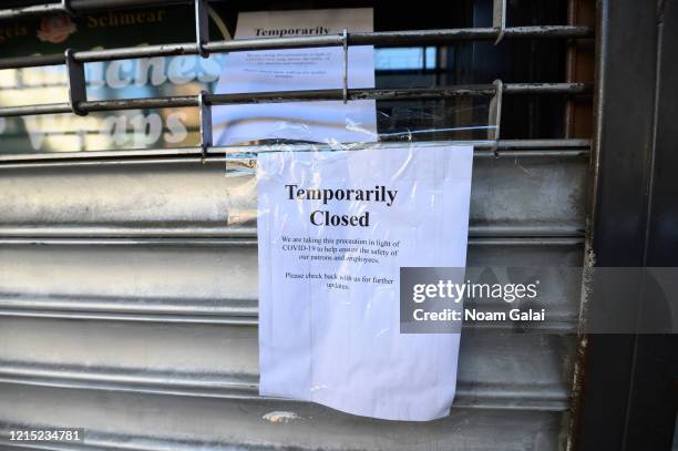 Note posted outside a restaurant in Kips Bay as the coronavirus continues to spread across the United States on March 27, 2020 in New York City. The...