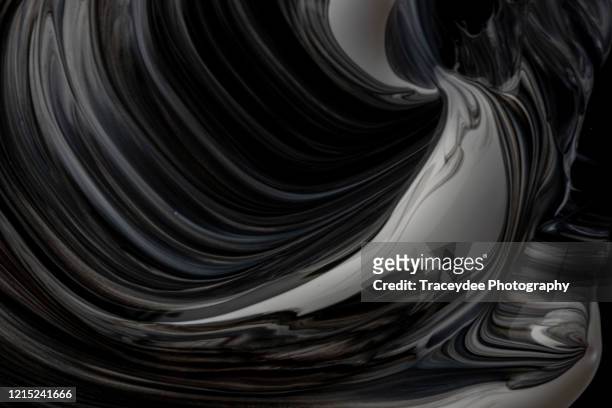 black and white paint swirl - wet see through stock pictures, royalty-free photos & images