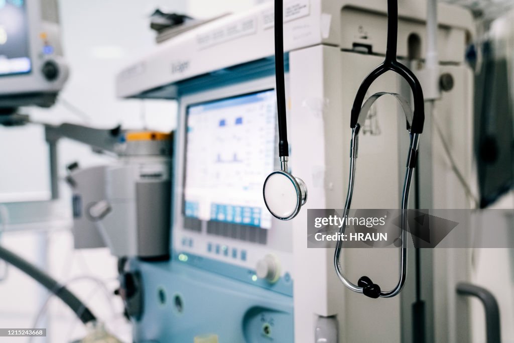 Stethoscope next to medical ventilator in emergency room.