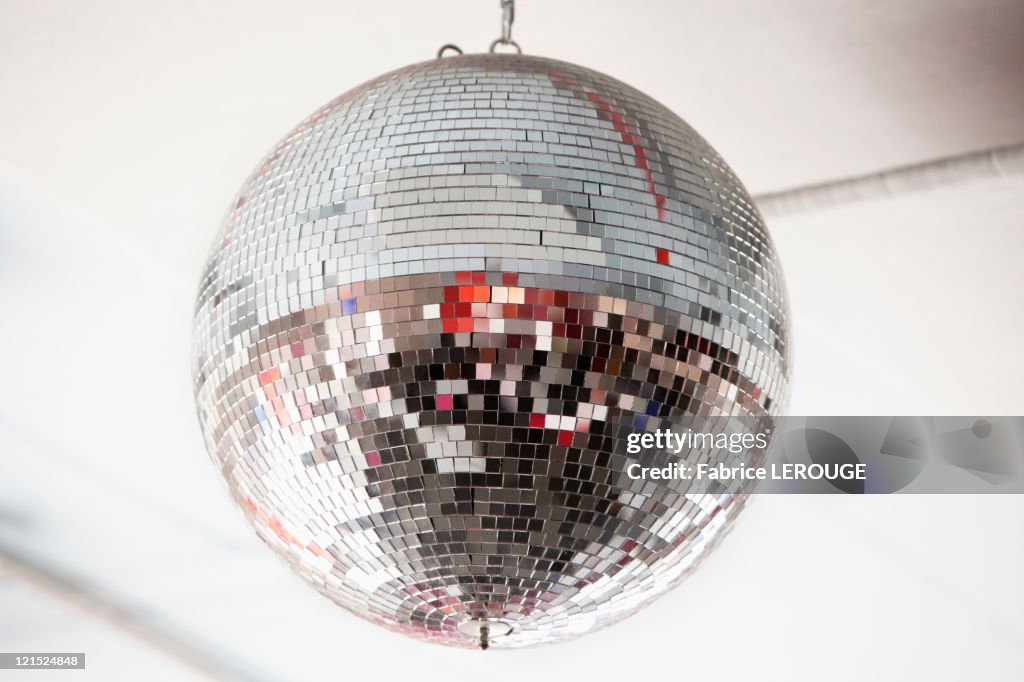 Low angle view of a mirrored disco ball in a nightclub