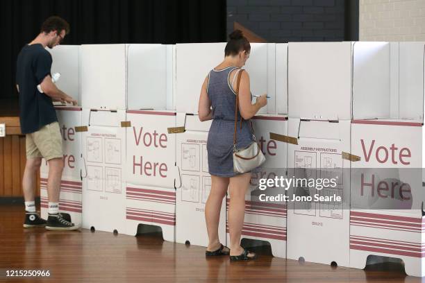 Voters are seen keeping a distance at Brisbane City Hall on March 28, 2020 in Brisbane, Australia. Queensland local government elections and two...