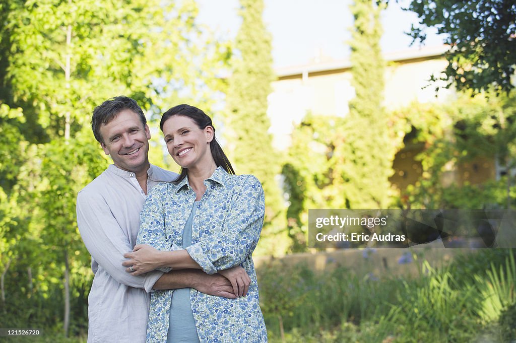 Portrait of a happy mature couple romancing in a garden