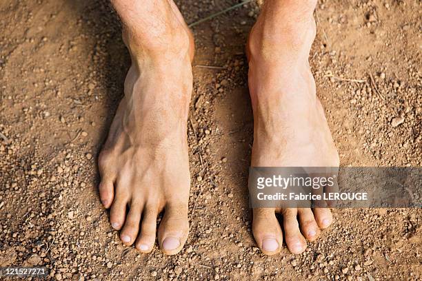 low section view of a barefooted man - mens bare feet stock pictures, royalty-free photos & images
