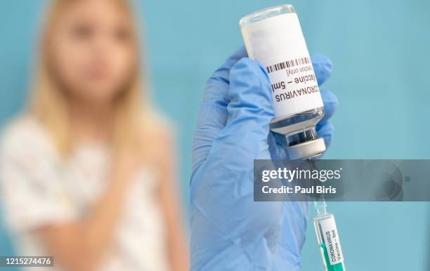 illustrative picture of a young boy getting vaccinated against coronavirus, covid-19 - getting out stock pictures, royalty-free photos & images