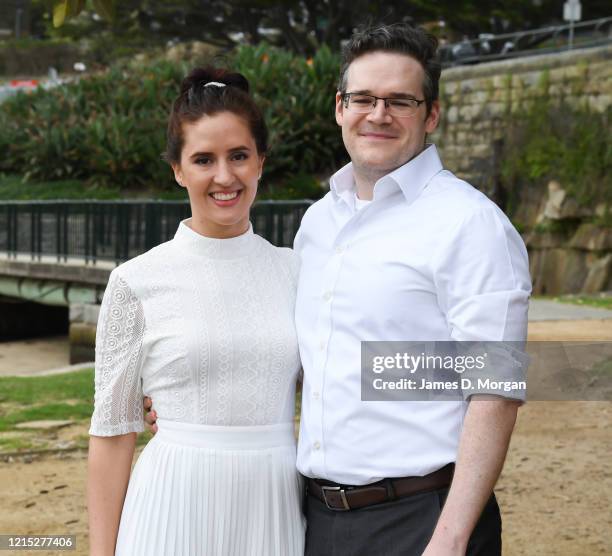 Lara Laas and Daniel Clark pose for a photo after they are married at Captain Henry Waterhouse Reserve in Kirribilli on March 28, 2020 in Sydney,...