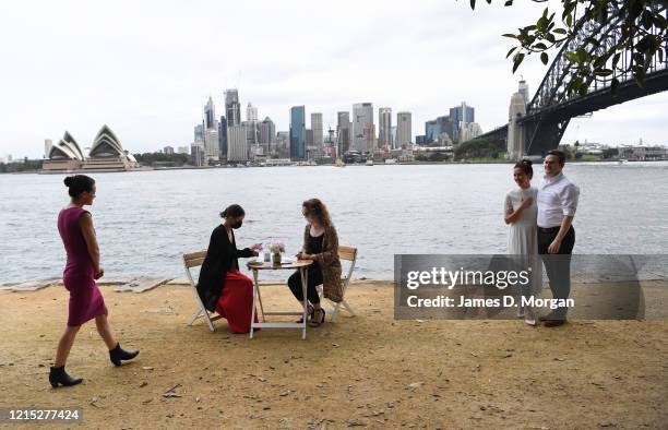 Lara Laas and Daniel Clark watch their two witnesses sign the marriage paperwork as they are married at Captain Henry Waterhouse Reserve in...