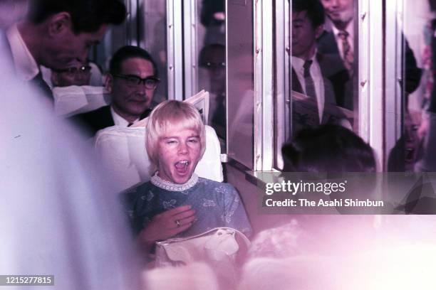 Figure skater Janet Lynn yawns in the train on her way to Mito on June 23, 1972 in Tokyo, Japan.
