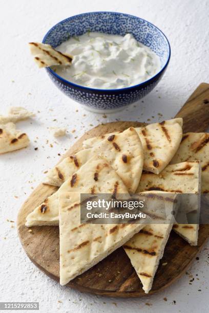 tzatziki dip and pita bread chips - dip stock pictures, royalty-free photos & images